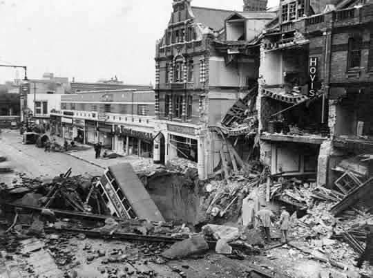 A London bus after falling into a massive bomb crater