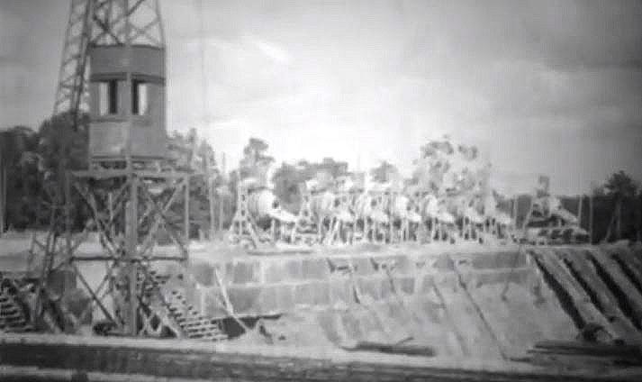 Engineers rebuilding bridge, clearing mines