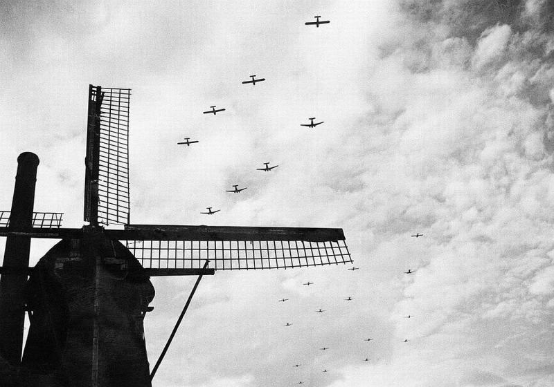 C-47 Skytrains towing Waco CG-4 gliders over Bergeijk