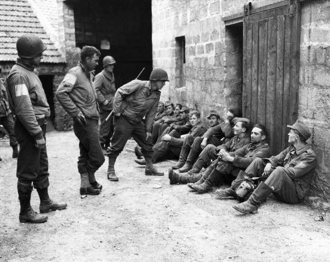 Three American soldiers, look at their former captors